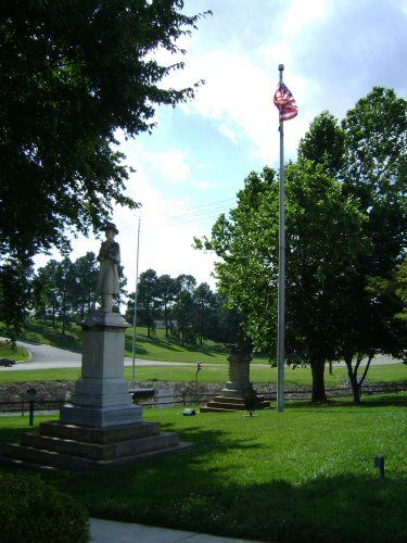 Statue and American Flag on a Lawn
